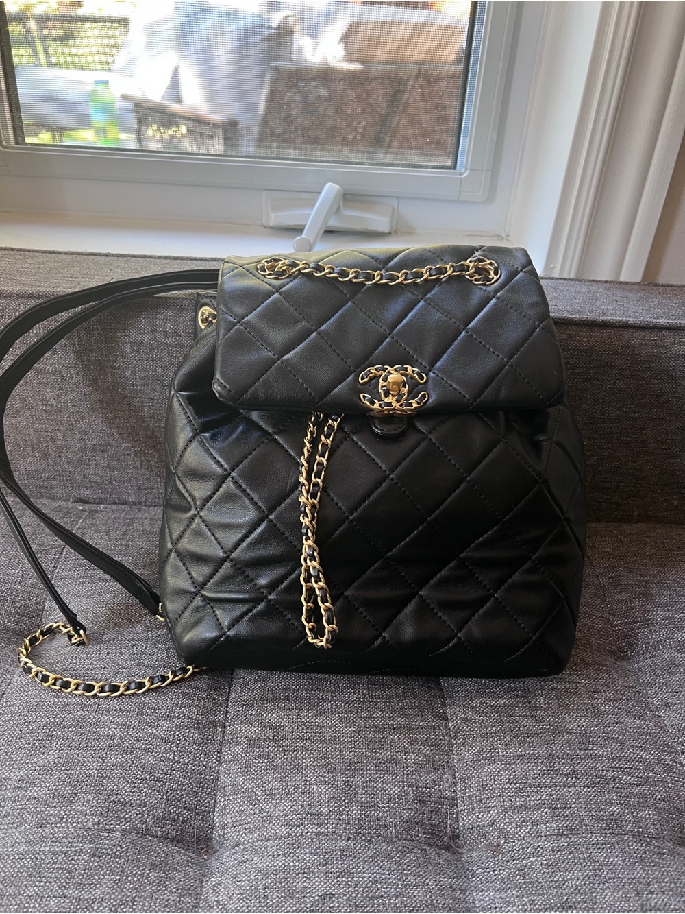 Black Quilted Leather Backpack with Gold Chain Accents